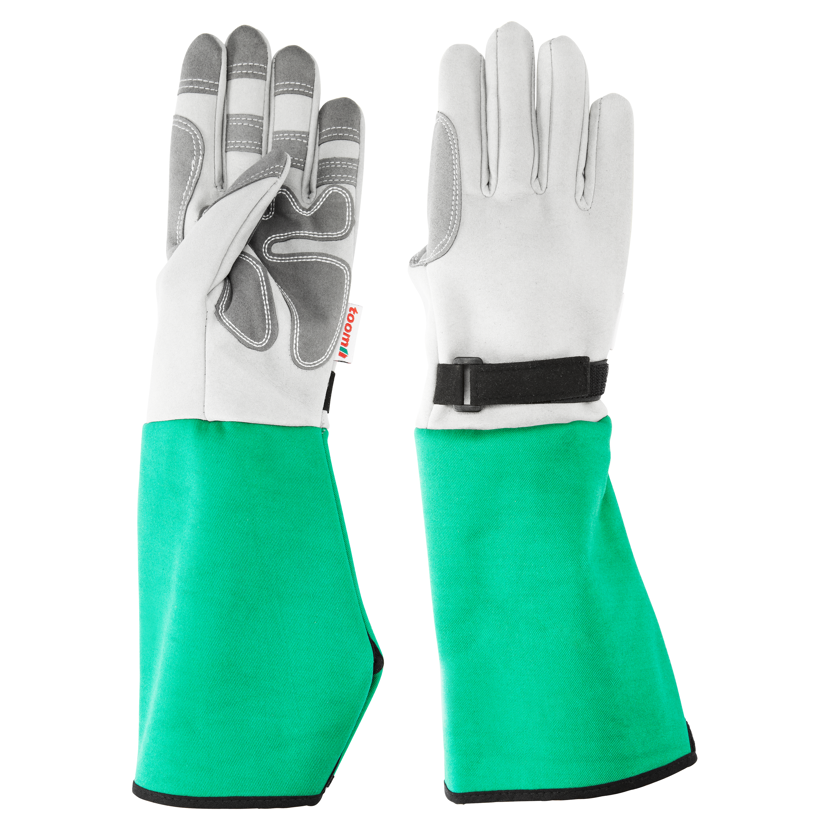 Ein Paar grüne und weiße Spezialhandschuhe