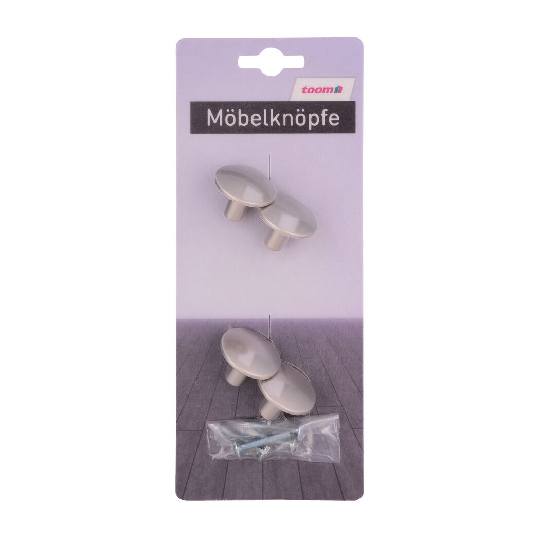 Vier Möbelknöpfe und Schrauben in Verpackung.