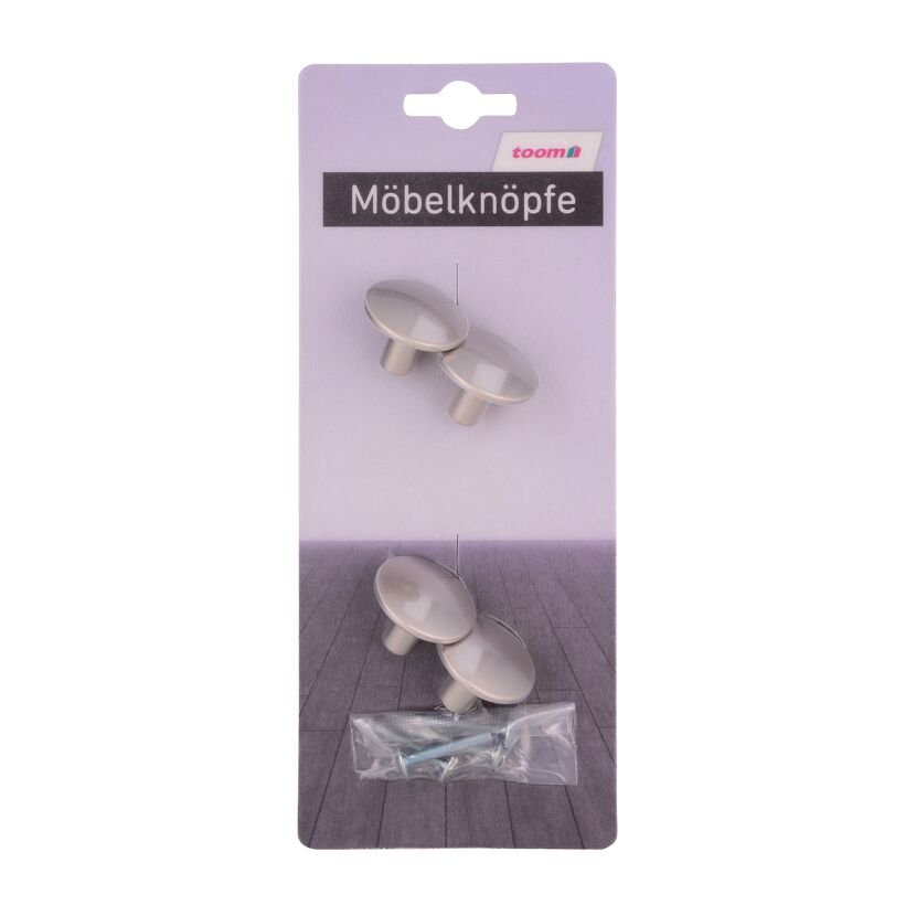 Vier Möbelknöpfe und Schrauben in Verpackung.