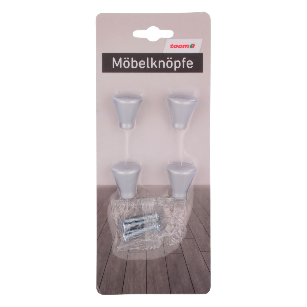 Vier silberne Möbelknöpfe in Verpackung
