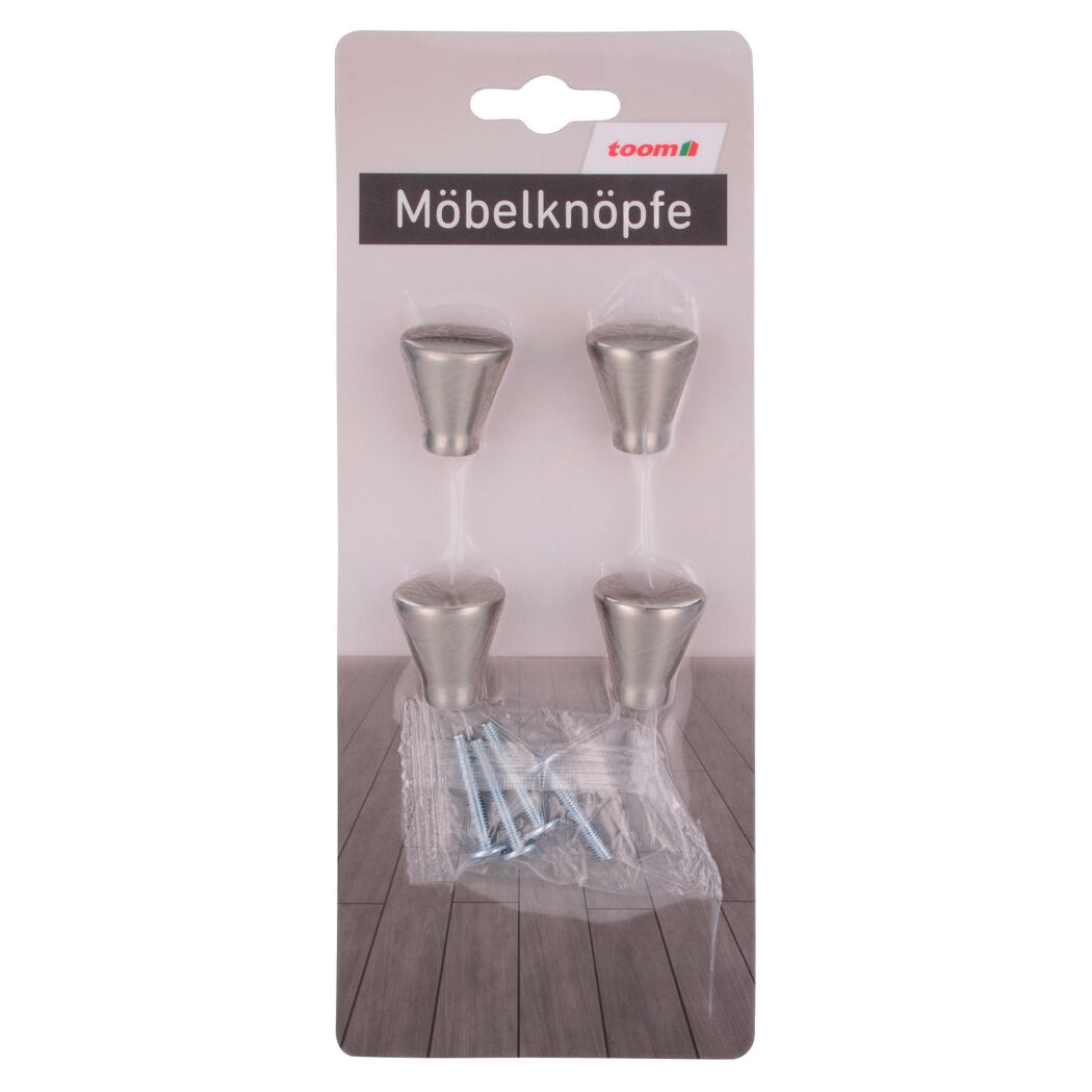 Vier Möbelknöpfe und Schrauben in Verpackung.
