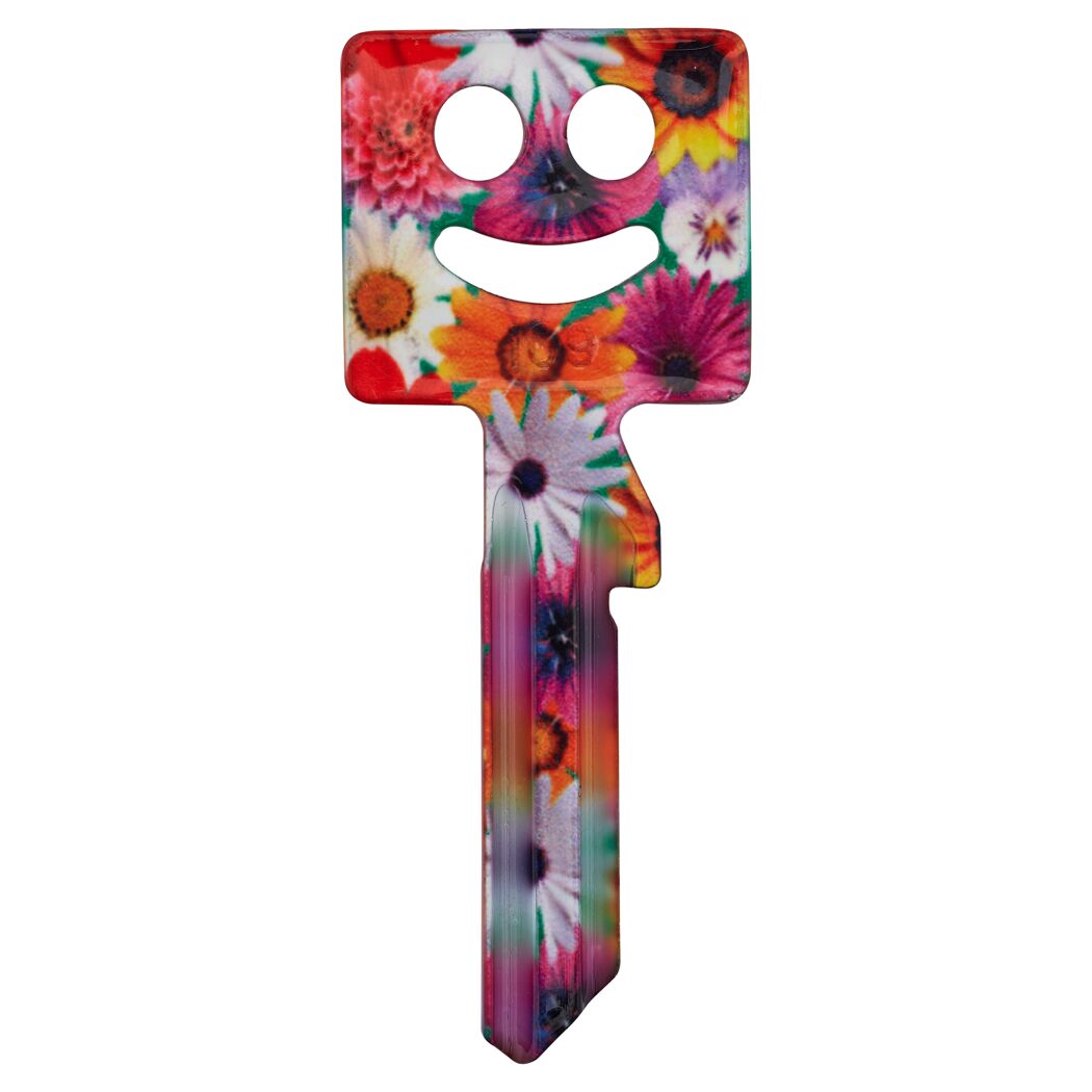Bunter Schlüssel mit Blumendesign und lachenden Gesicht.