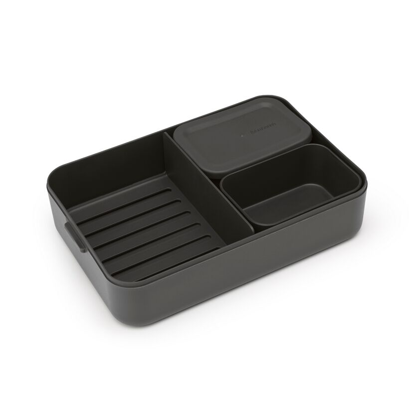 Graue Bento-Lunchbox mit Unterteilungen.