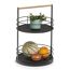 Schwarze Etagere mit Obst und Pflanze