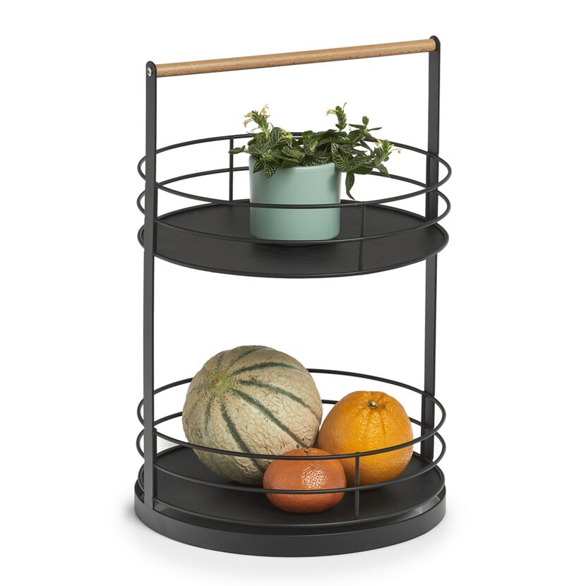 Schwarze Etagere mit Obst und Pflanze