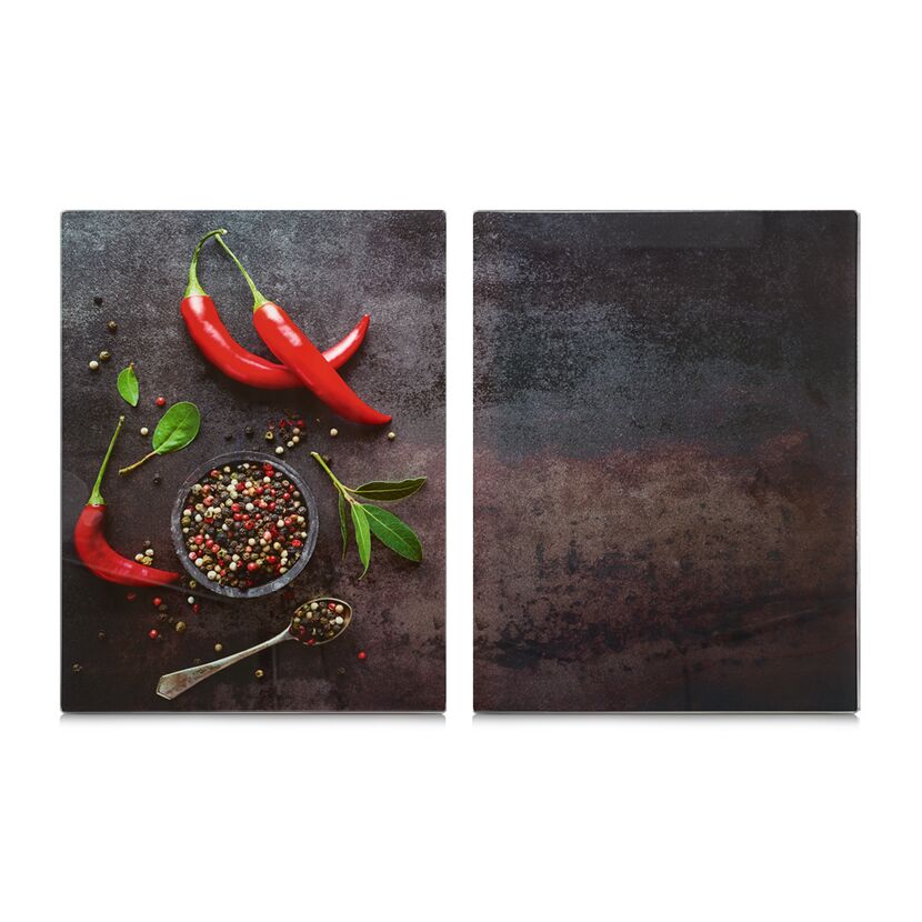 Chilischoten und Pfefferkörner auf dunkler Fläche
