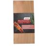 Zwei Zedernholzbretter mit Verpackung und gegrilltem Lachs