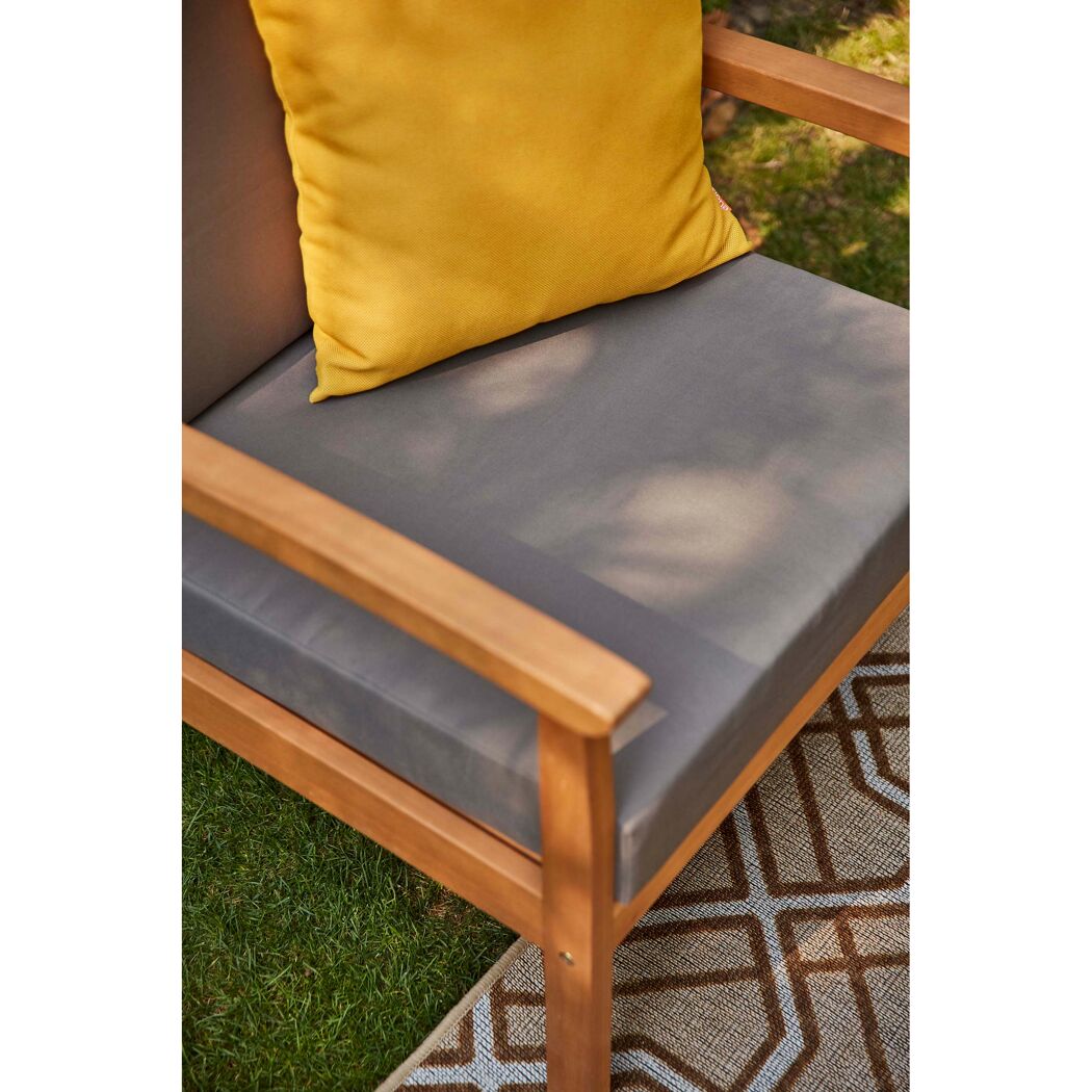 Lounge Tavira Gartensessel mit grauem Sitzkissen und gelbem Dekokissen