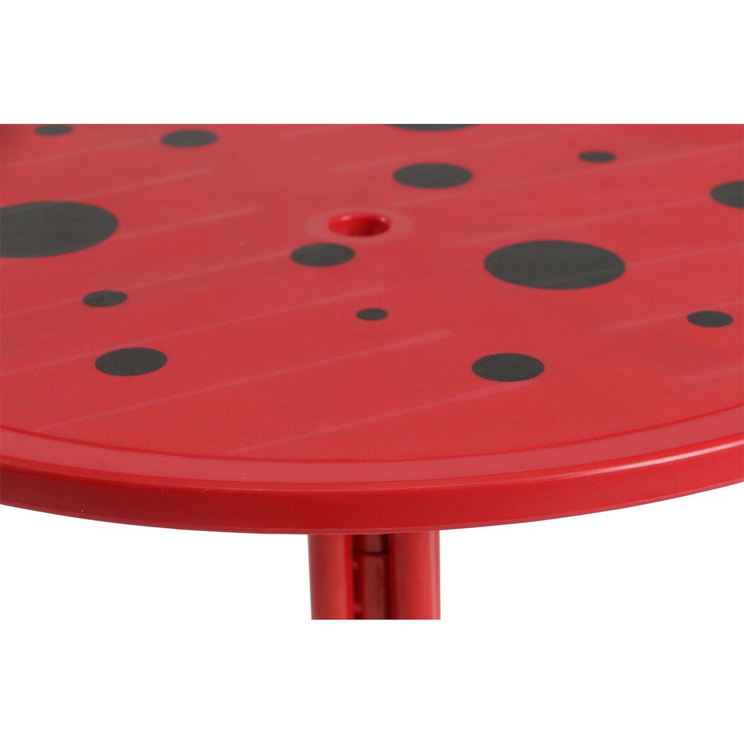 Roter Kindertisch mit schwarzen Punkten
