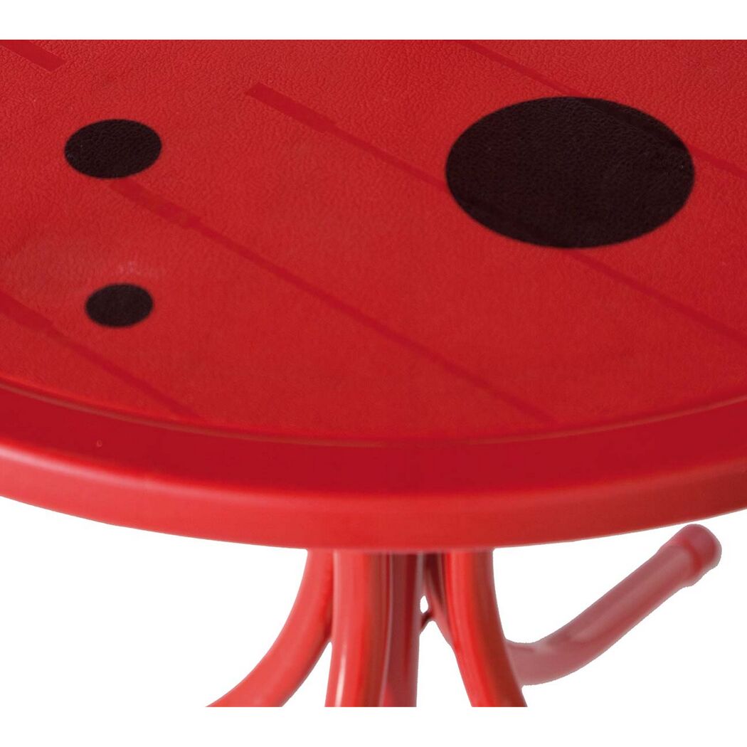 Roter Kindertisch mit schwarzen Punkten
