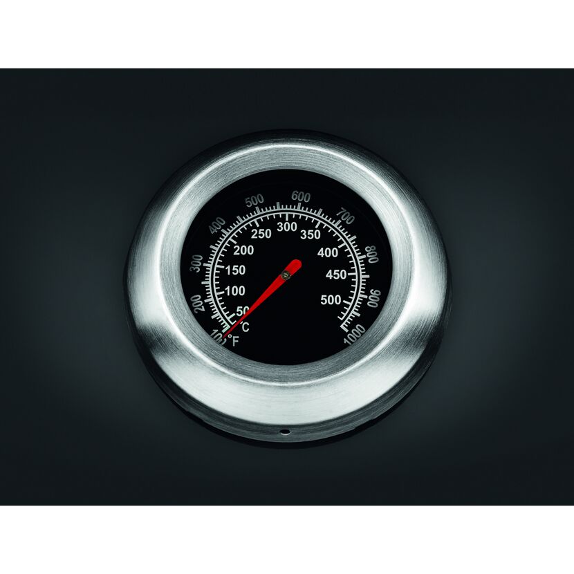 Ein Thermometer mit roten Zeiger.