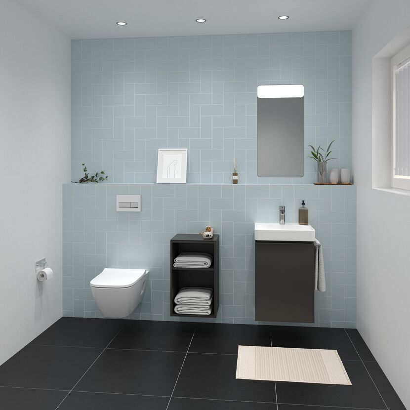 Modernes Badezimmer mit hellblauen Fliesen und schwarzem Boden