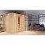 Sauna Aitana Front9KW natur in einem Raum mit Sofa und Steinwand