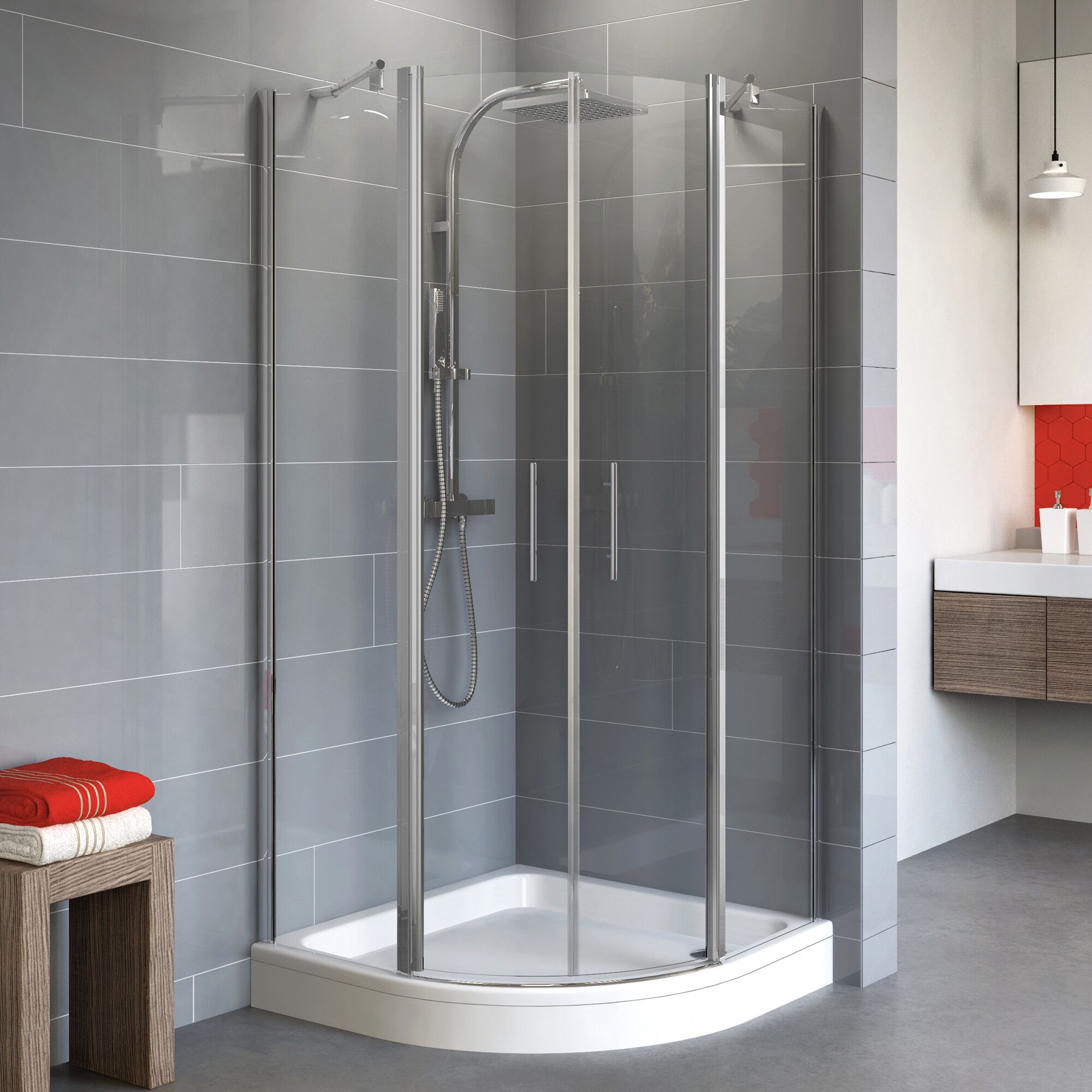 Duschkabine mit runder Duschwanne und grauen Fliesen