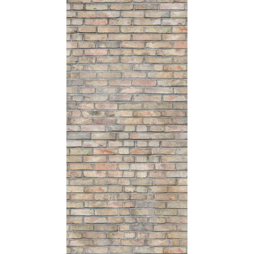 Nahaufnahme einer beigefarbenen Ziegelwand