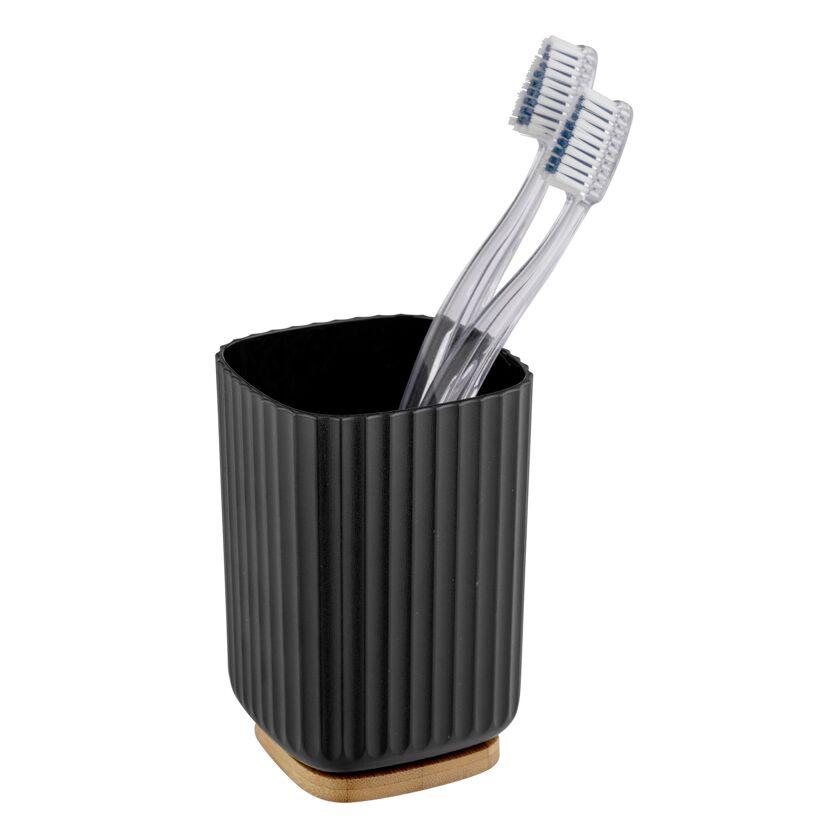 Zwei Zahnbürsten in einem schwarzen Zahnputzbecher.