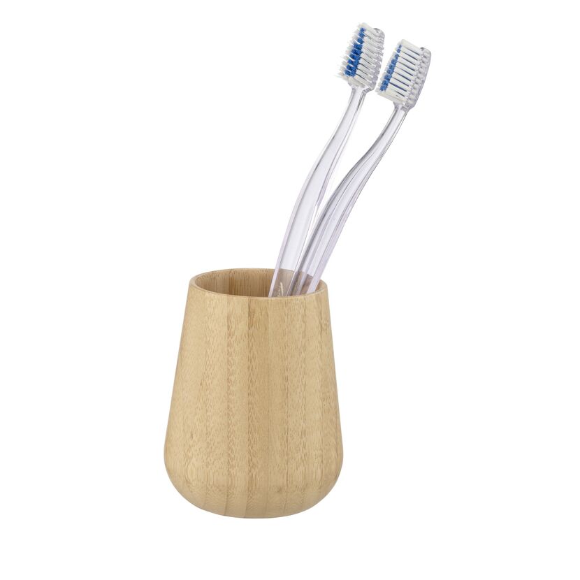Zwei Zahnbürsten in einem Bambusbecher