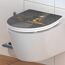 WC-Sitz mit goldenem meditierendem Frosch