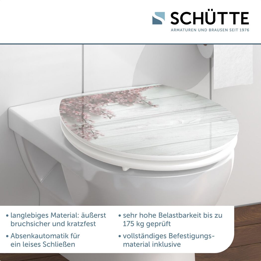 WC-Sitz mit Kirschblüten-Motiv auf Holzoptik
