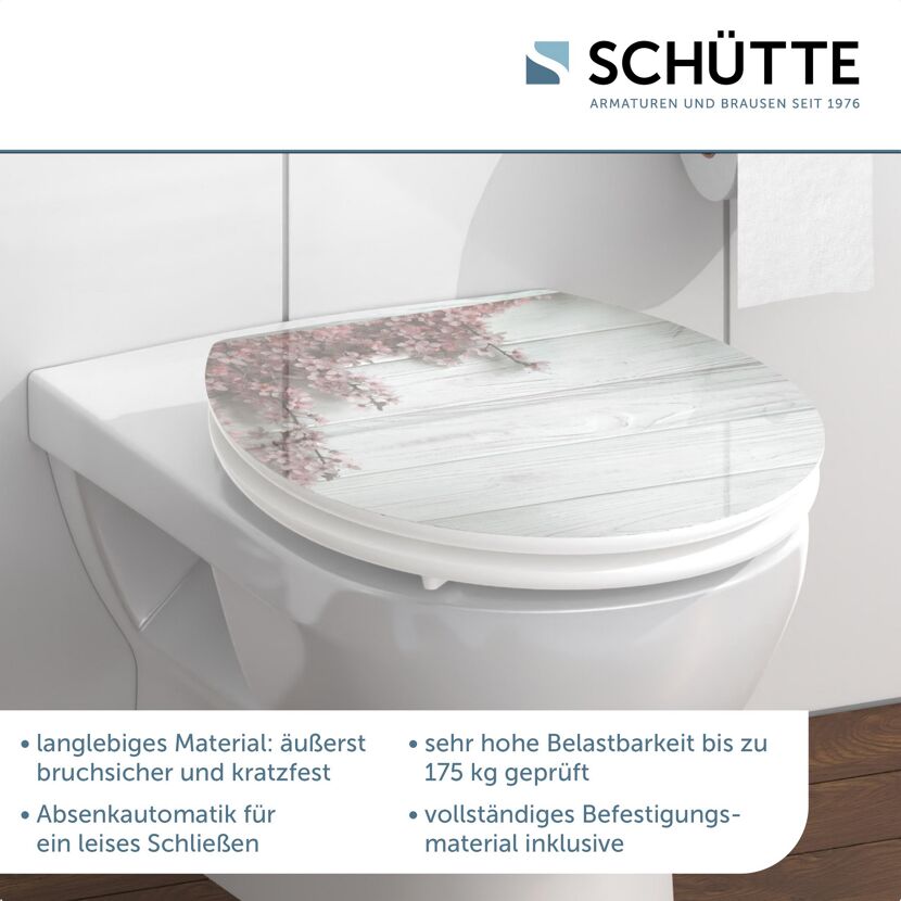 WC-Sitz mit Kirschblüten-Motiv auf Holzoptik
