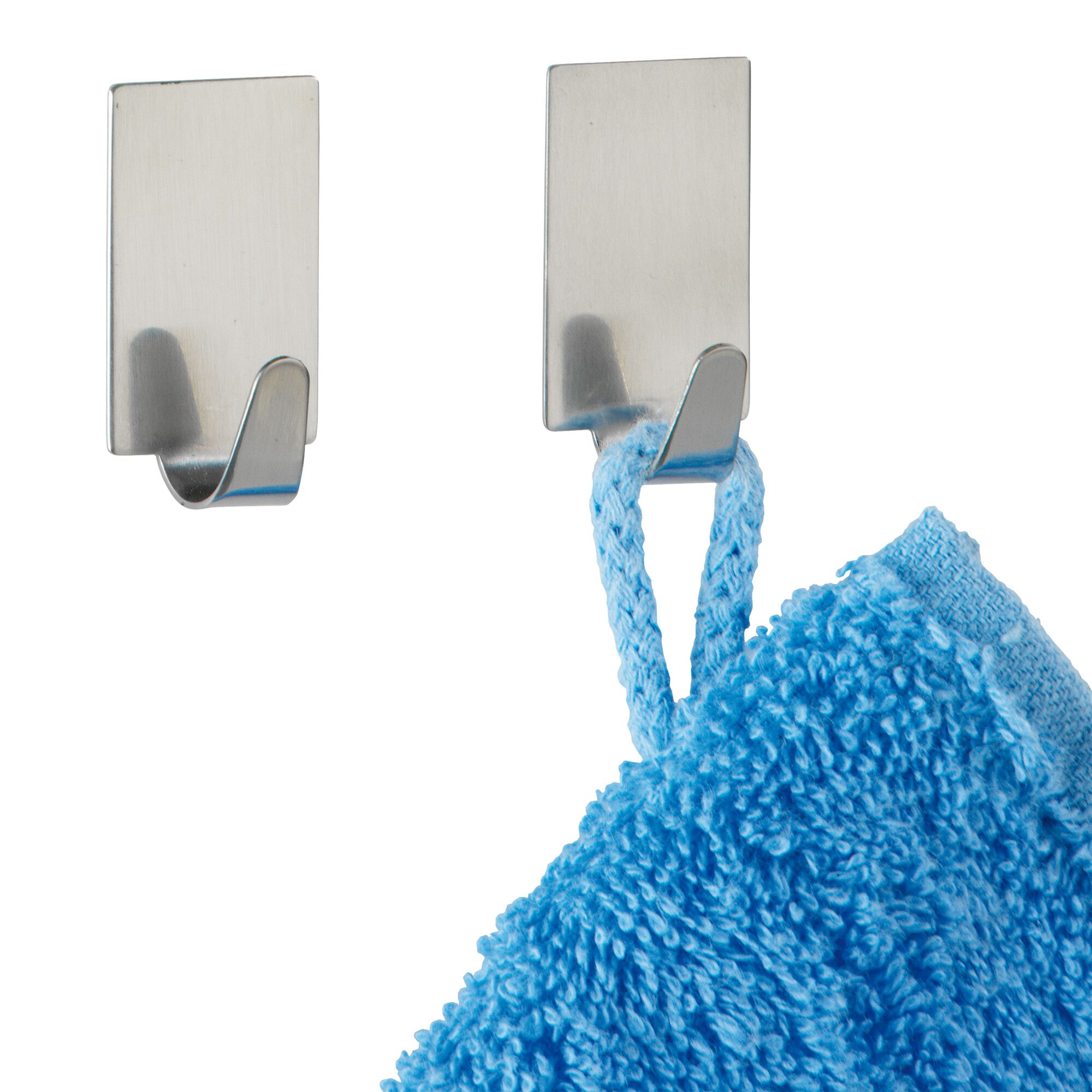 Zwei selbstklebende Edelstahlhaken, einer mit blauem Handtuch