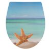 WC-Sitz mit Seestern-Motiv am Strand