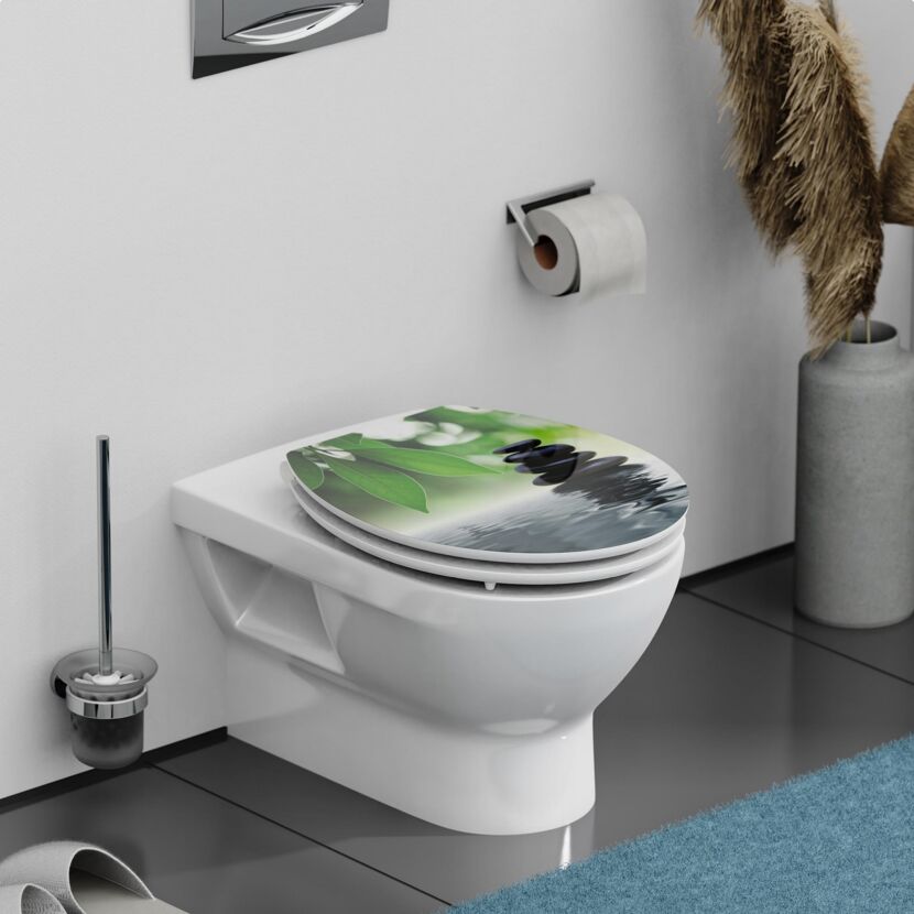 WC-Sitz mit grünem Blatt- und Steindesign