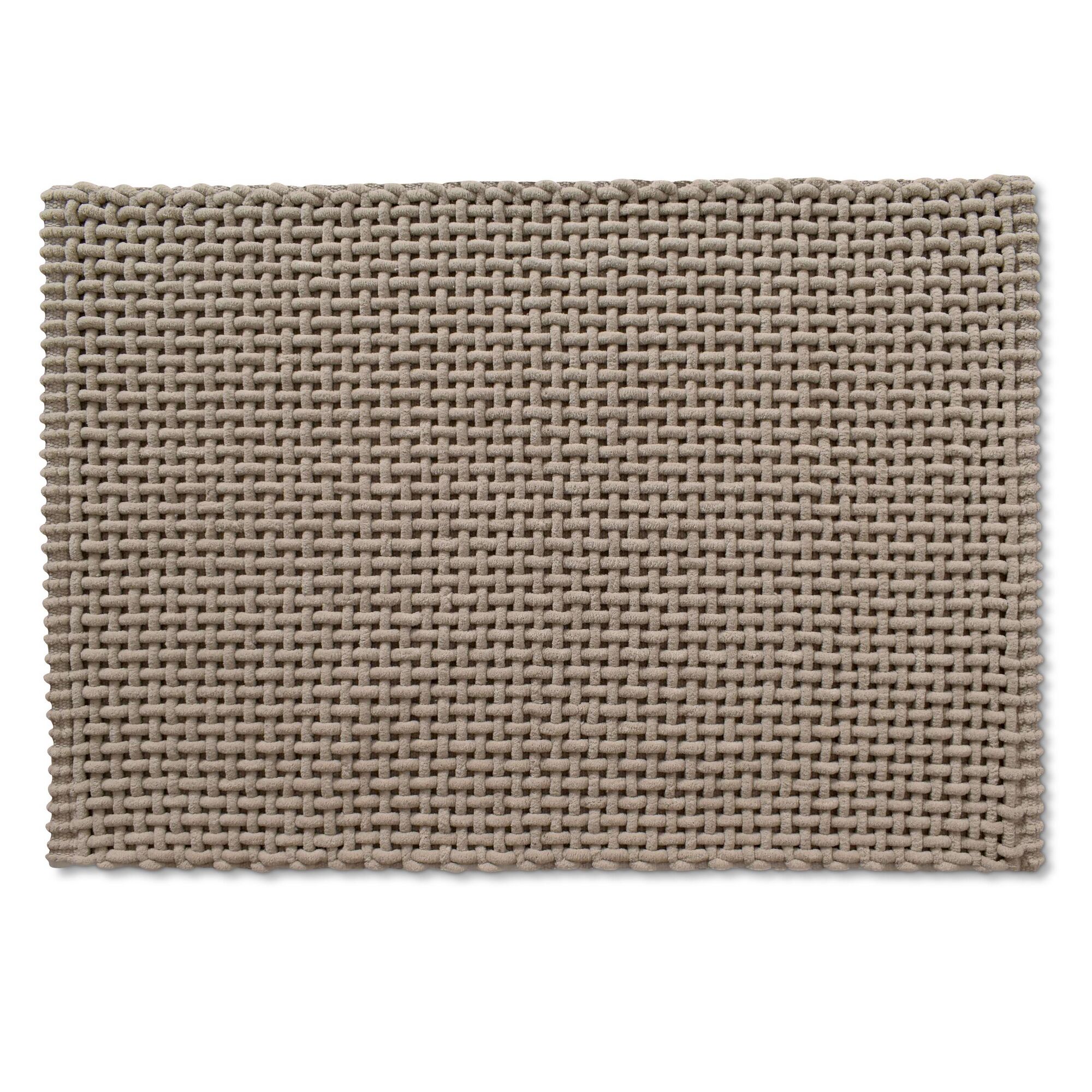 Beiger Badteppich mit gewebter Struktur.