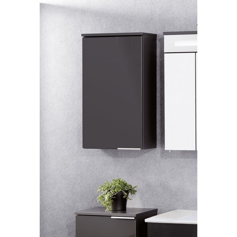 Anthrazitfarbener Hängeschrank an der Wand.