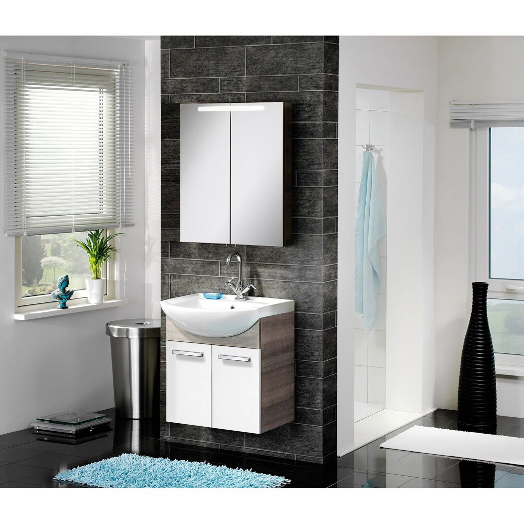 Weißes Waschbecken mit Unterschrank und Spiegelschrank