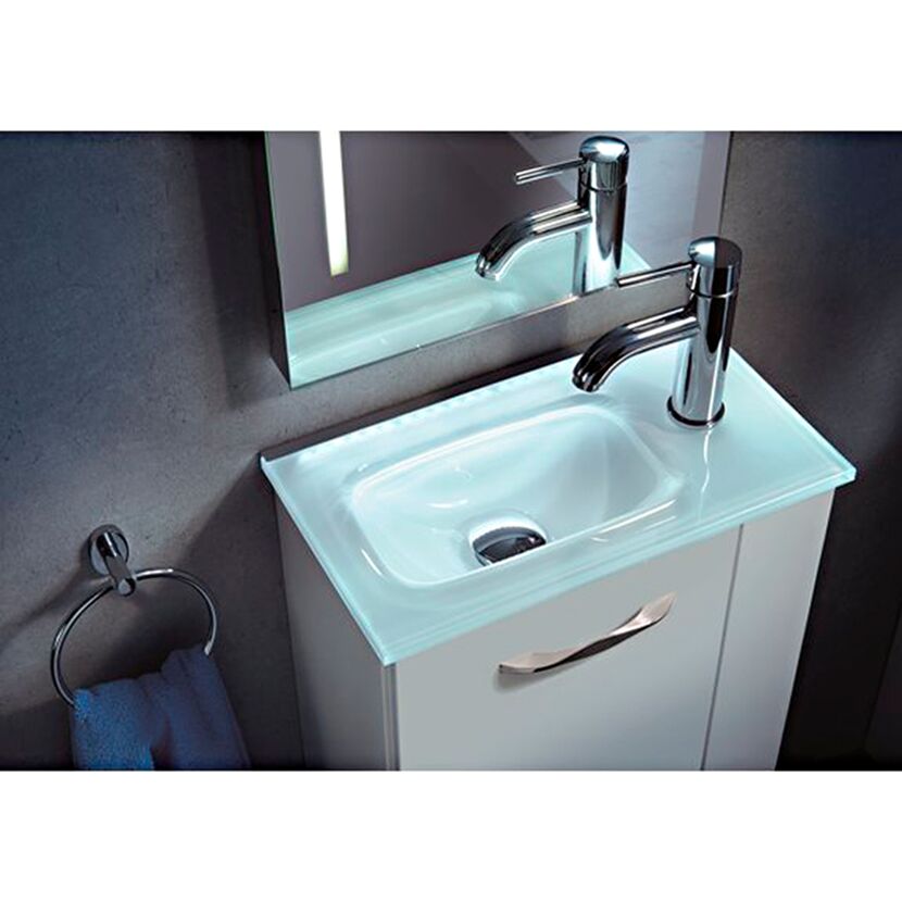 Weißes Handwaschbecken mit beleuchteter Glasplatte und Wasserhahn.