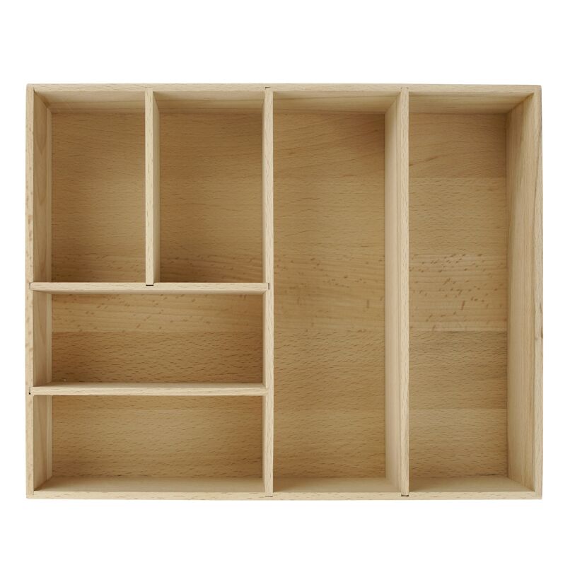 Leere Schubladenbox aus hellem Holz.