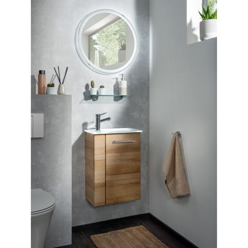 Waschbeckenunterschrank mit Spiegel und Handtuch