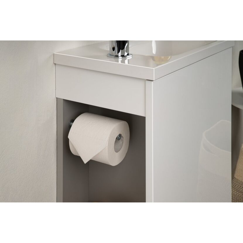 Toilettenpapier auf einer Halterung unter einem Waschbecken.