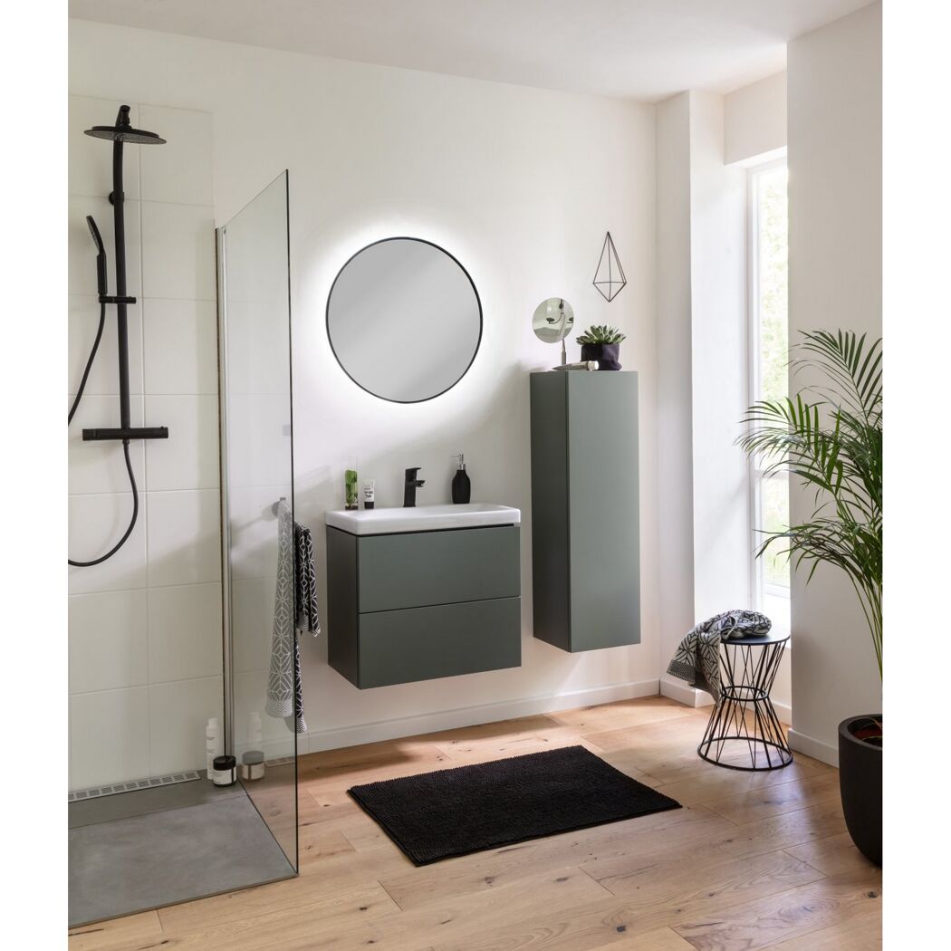 Modernes Badezimmer mit grauen Badmöbeln und rundem Spiegel