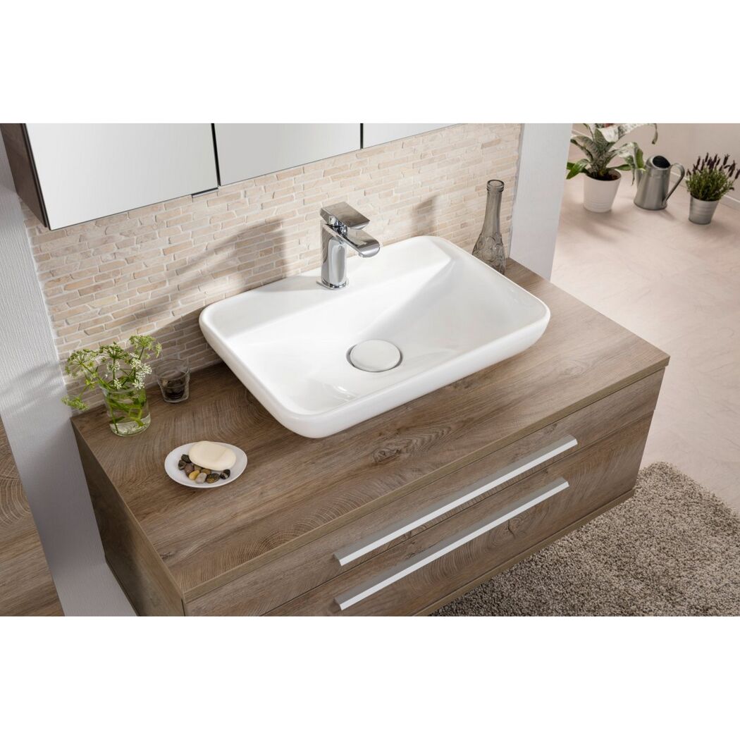 Waschbecken auf braunem Waschtischunterschrank