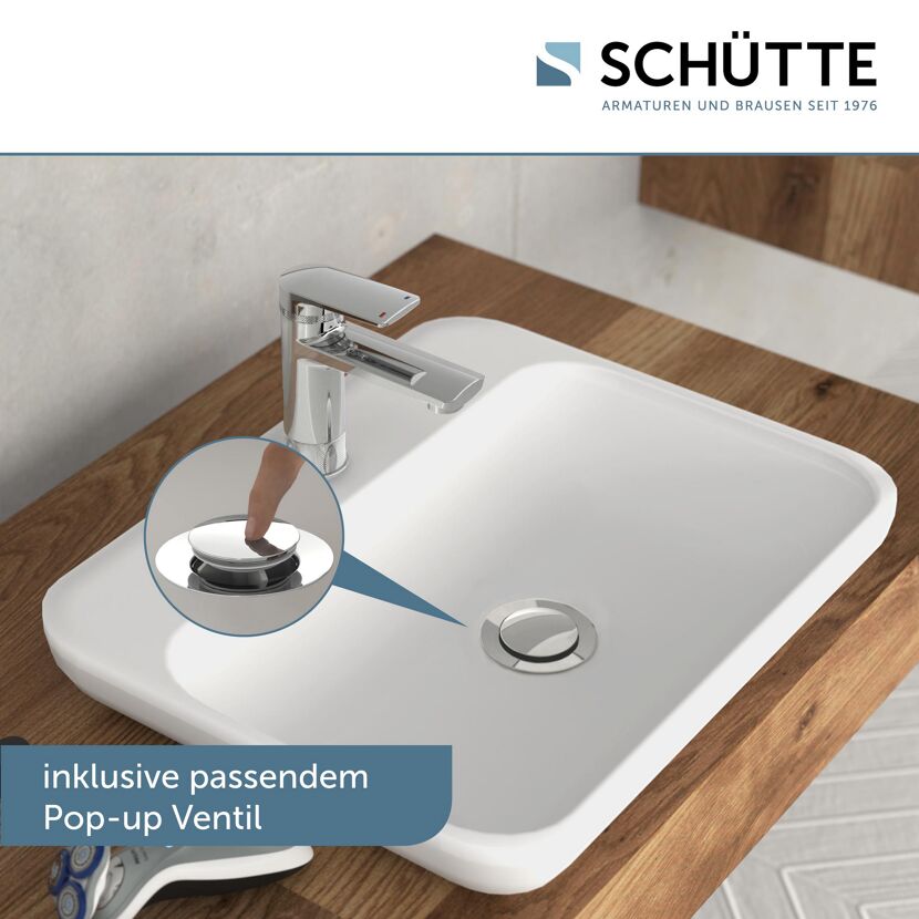 Finger drückt Pop-up Ventil am Waschbecken herunter
