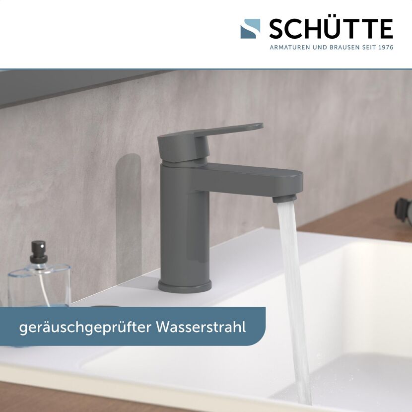 Anthrazitfarbener Wasserhahn mit laufendem Wasser