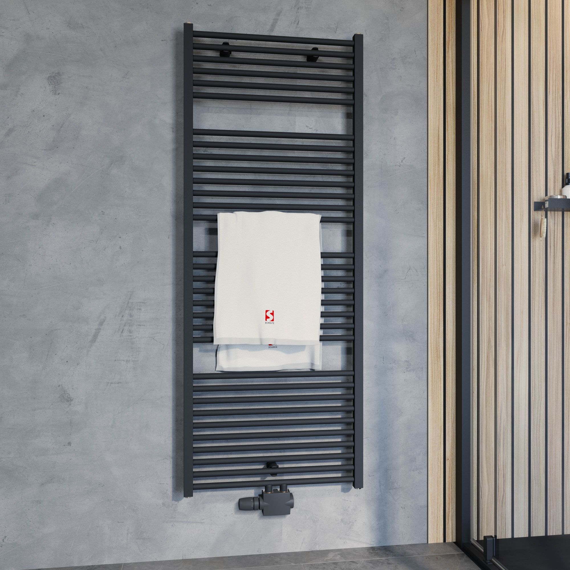 Schwarzer Handtuchheizkörper mit weißem Handtuch