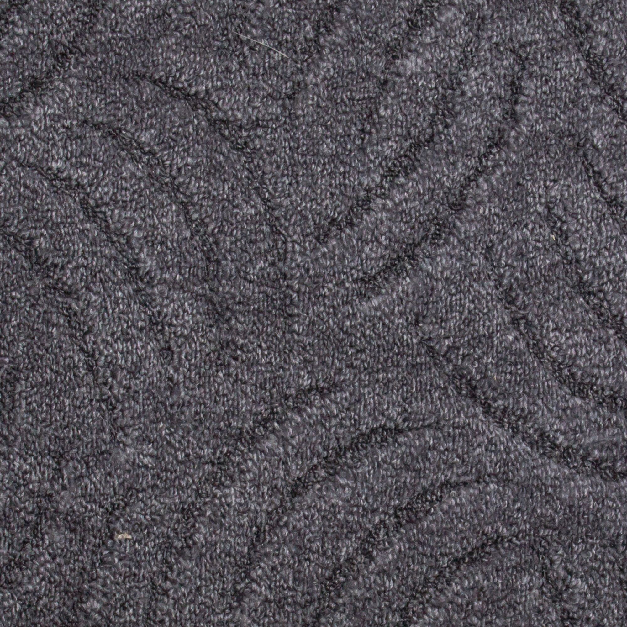 Nahaufnahme grauer Teppichboden Emmy