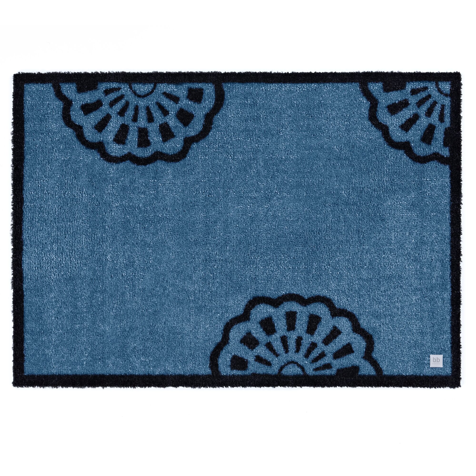 Blaue Fußmatte mit schwarzem Spitzenmuster