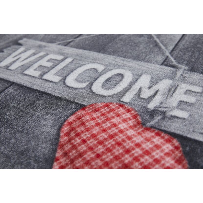 Fußmatte mit "Welcome"-Schild und Herz