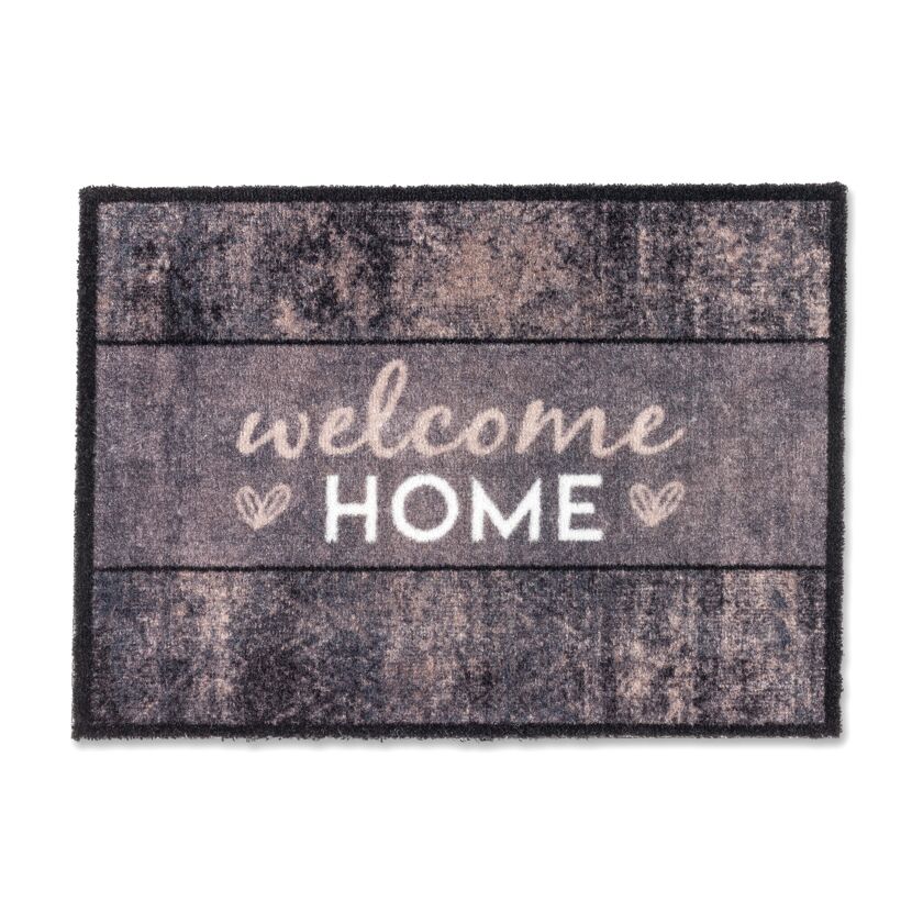 Fußmatte mit "Welcome Home" Schriftzug.