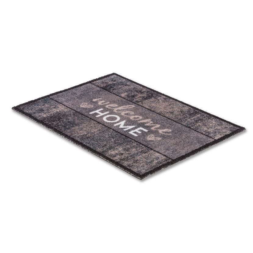 Schwarze Fußmatte mit "Welcome Home" Schriftzug