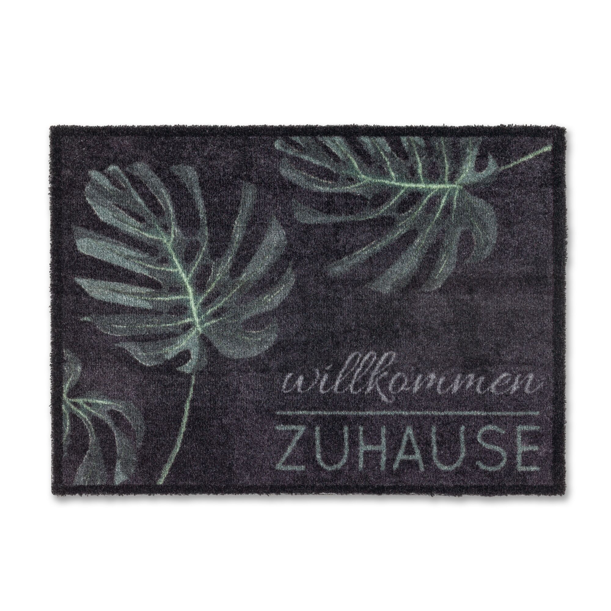 Schwarze Fußmatte mit grünem Blattmuster und "Willkommen Zuhause" Schriftzug.