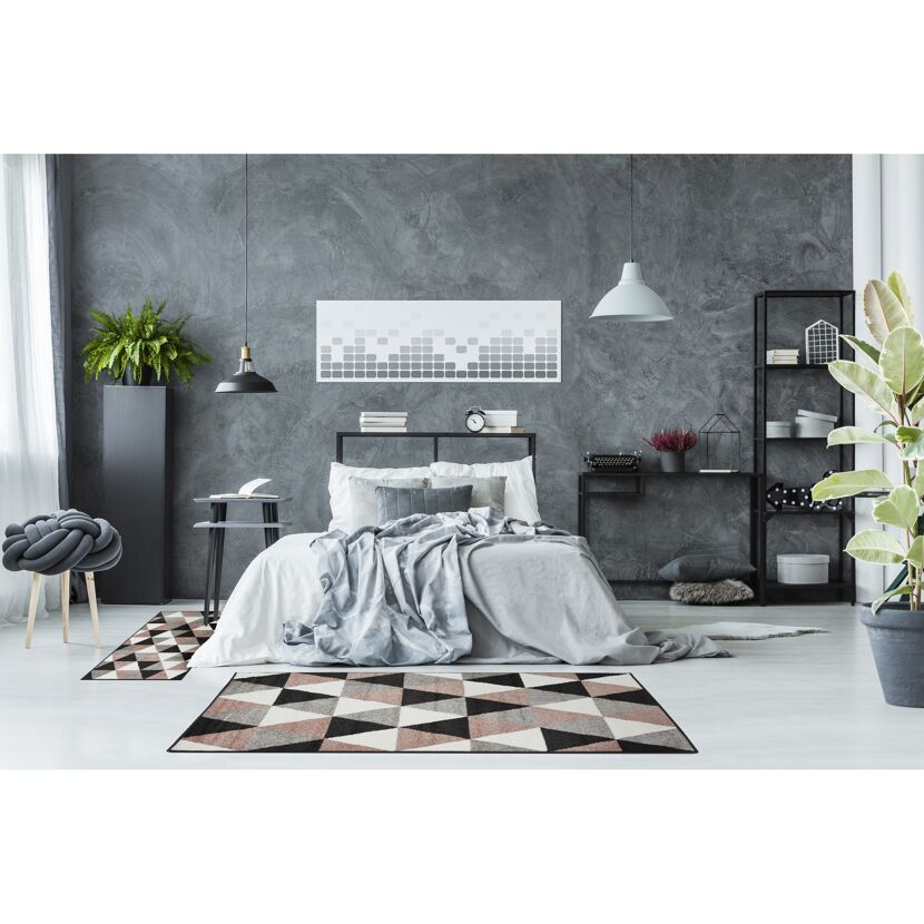 Modern eingerichtetes Schlafzimmer mit grauem Teppich