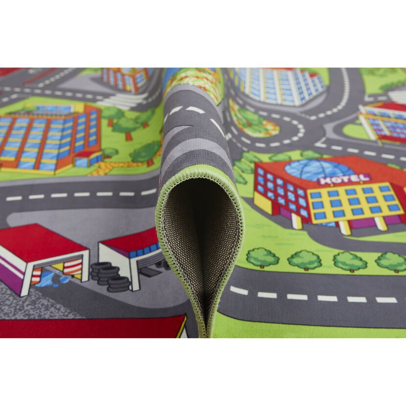 Spielteppich mit Straßen und Häusern.