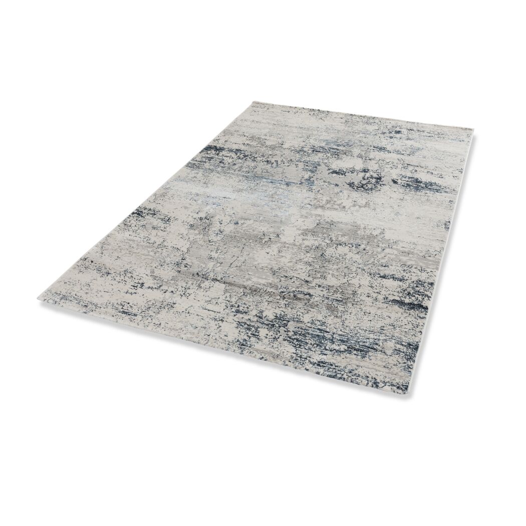 Beiger Teppich mit blauem Muster