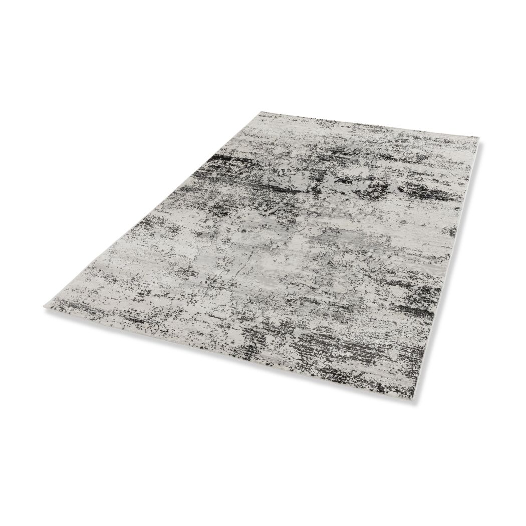 Beiger Teppich mit schwarzem Muster