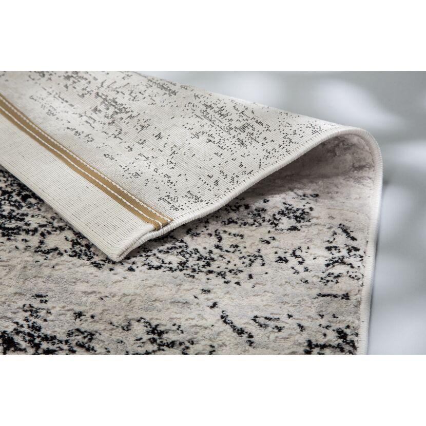 Beigefarbener Teppich mit Muster